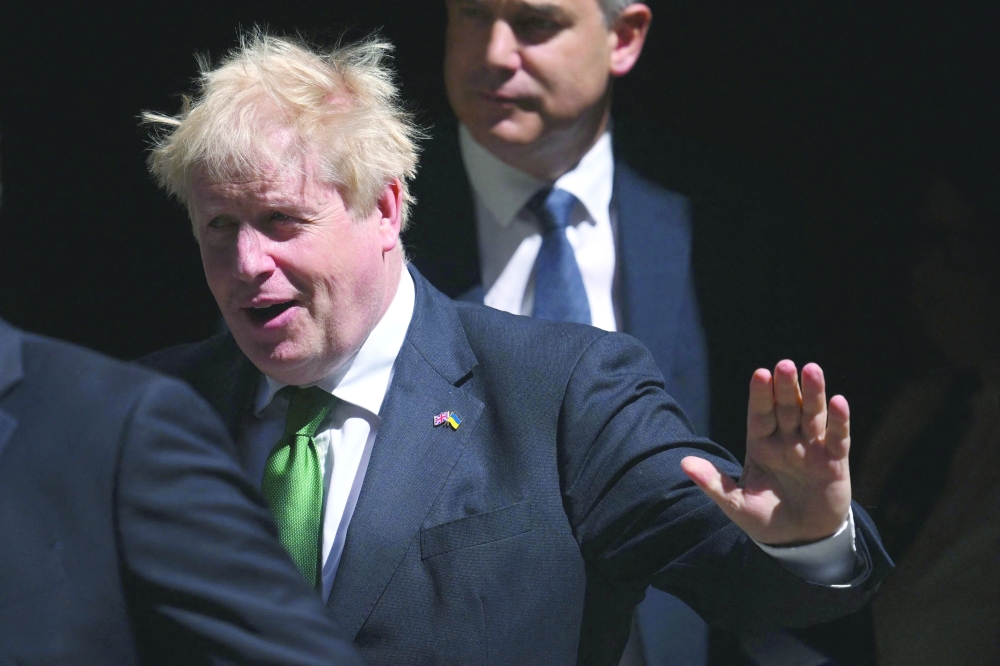 Britain's Prime Minister Boris Johnson leaves from 10 Downing Street in central London to attend the weekly session of Prime Minister's Questions (PMQs). — AFP