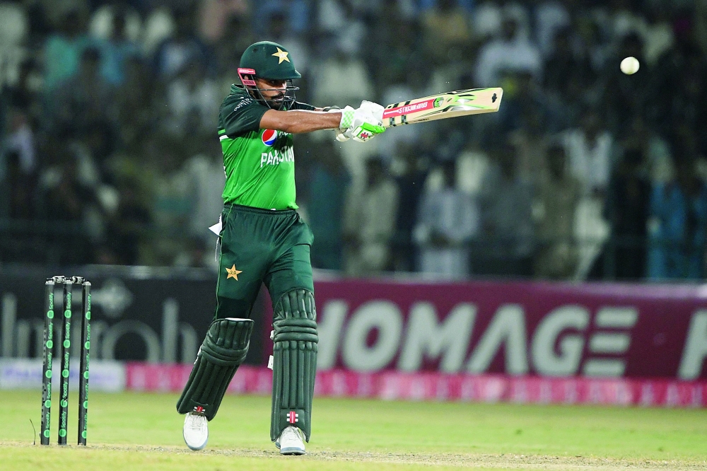 Pakistan's captain Babar Azam plays a shot during the first one-day international (ODI) cricket match between Pakistan and West Indies at the Multan Cricket Stadium in Multan on June 8, 2022.  (Photo by Aamir QURESHI / AFP)

