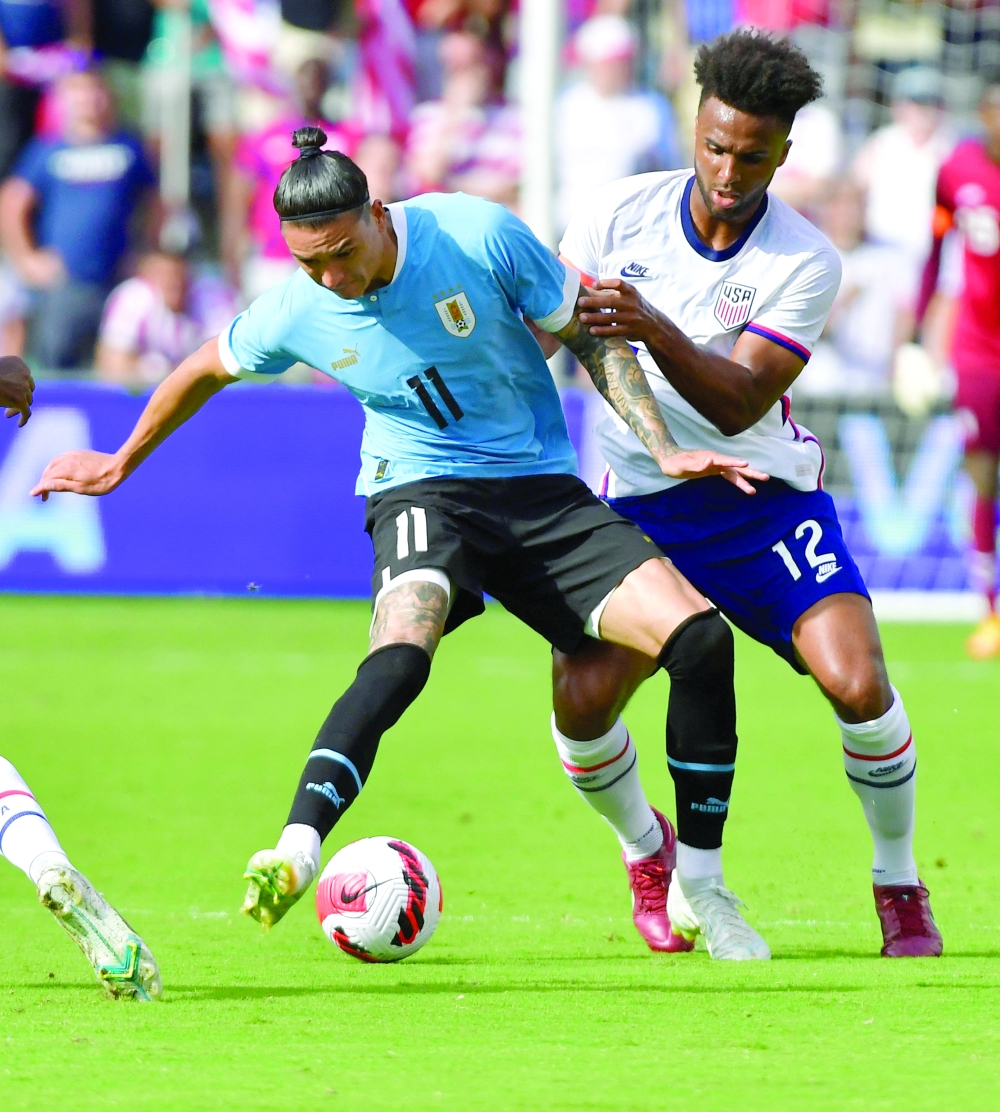 Uruguay's Darwin Nunez (L) and USA's Erik Palmer-Brown vie for the ball during a friendly. -- AFP