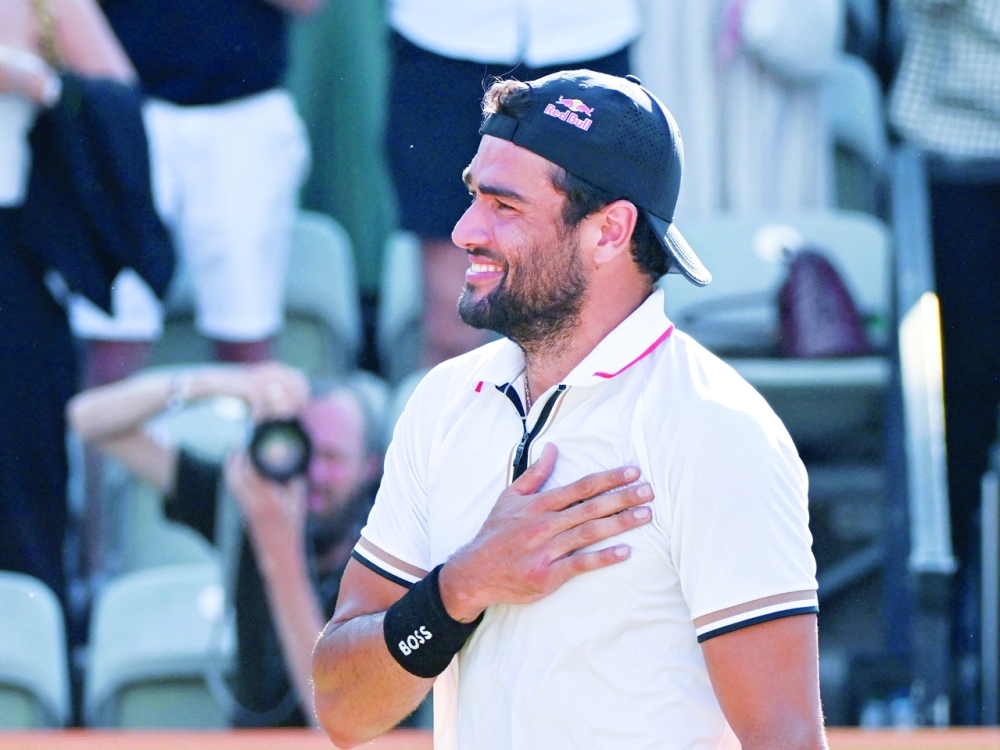 Italy's Matteo Berrettini reacts after winning the ATP tour final. -- AFP