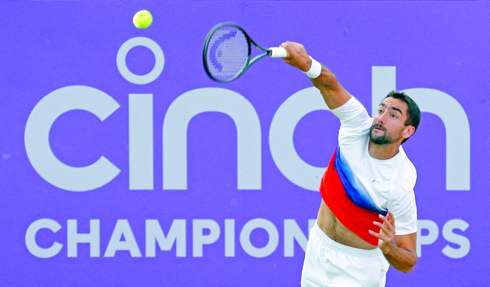 Croatia's Marin Cilic serves to Kazakhstan's Alexander Bublik during their men's singles match. -- AFP