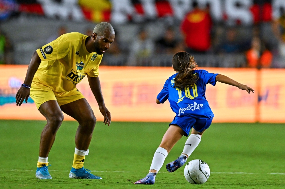 child playing football