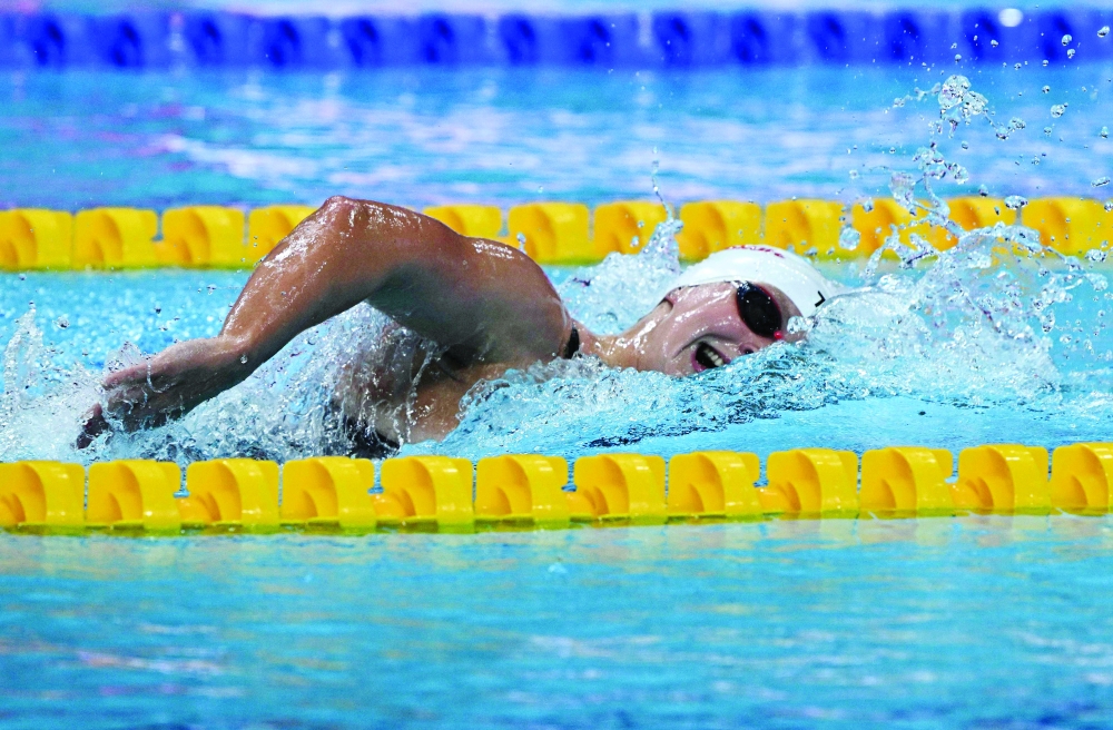 USA's Katie Ledecky competes to win a heat for the women's 1500m freestyle event during the Budapest 2022 World Aquatics Championships at Duna Arena in Budapest on June 19, 2022. (Photo by Attila KISBENEDEK / AFP)

