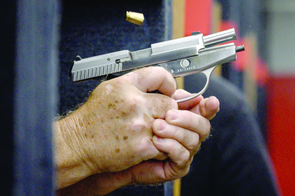 Shooting range owner John Deloca aims his pistol at his range in Queens, New York on June 23, 2022. The US Supreme Court ruled on June 23, 2022 that Americans have a fundamental right to carry a handgun in public, a landmark decision with far-reaching implications for states and cities across the country confronting a surge in gun violence. (Photo by Ed JONES / AFP)
