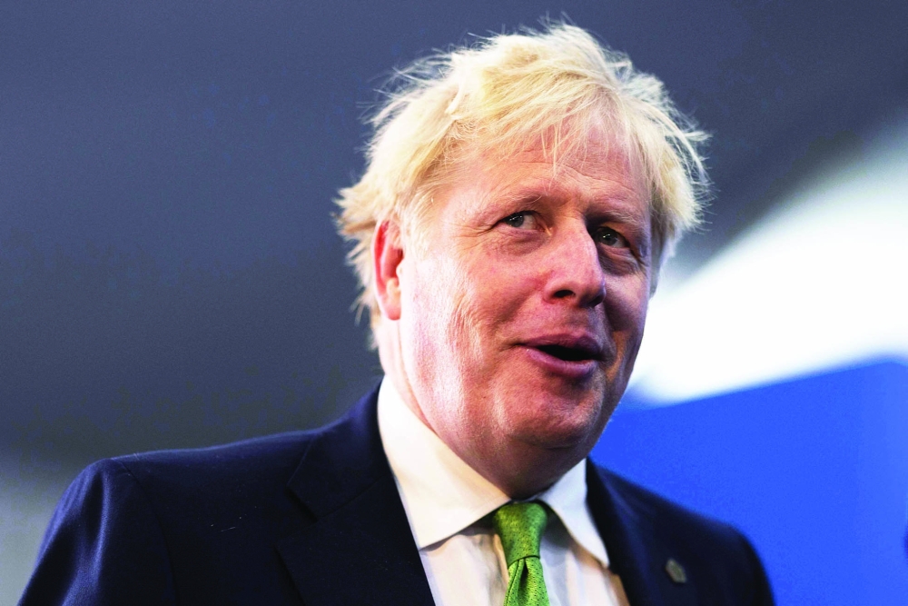 Britain's Prime Minister Boris Johnson attends  at the Business Forum  in Kigali on June 23, 2022, during the Commonwealth Heads of Government Meeting (CHOGM).
 Leaders of Commonwealth countries meet every two years for the Commonwealth Heads of Government Meeting (CHOGM), hosted by different member countries on a rotating basis. Since 1971, a total of 24 meetings have been held, with the most recent being in the UK in 2018. (Photo by Dan Kitwood / POOL / AFP)