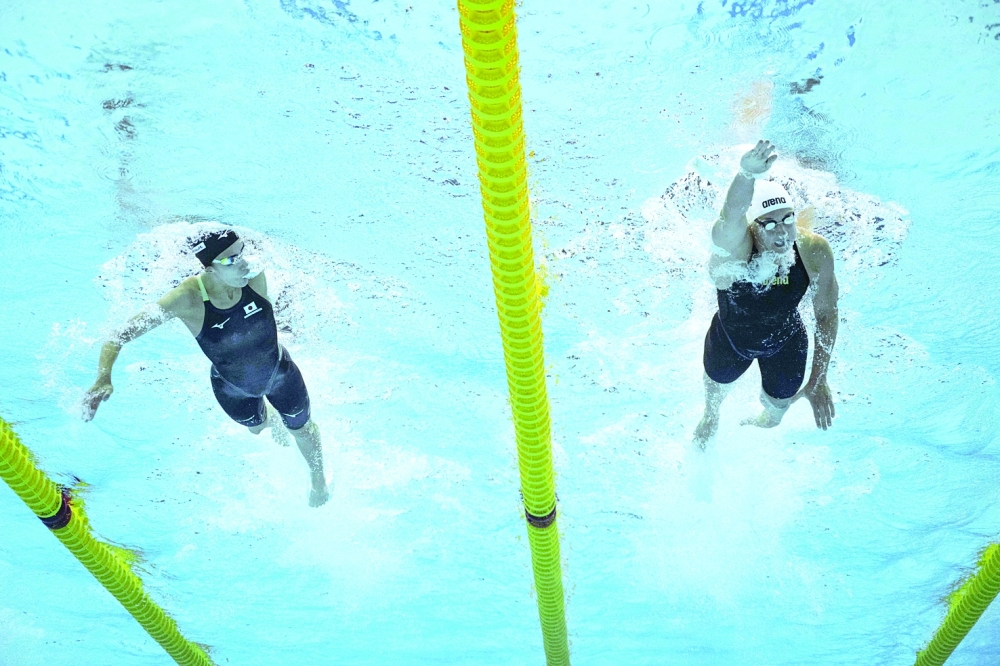 Japan's Yui Ohashi (L) and Hungary's Katinka Hosszu compete in a heat for the women's 400m medley event during the Budapest 2022 World Aquatics Championships at Duna Arena in Budapest on June 25, 2022. — AFP