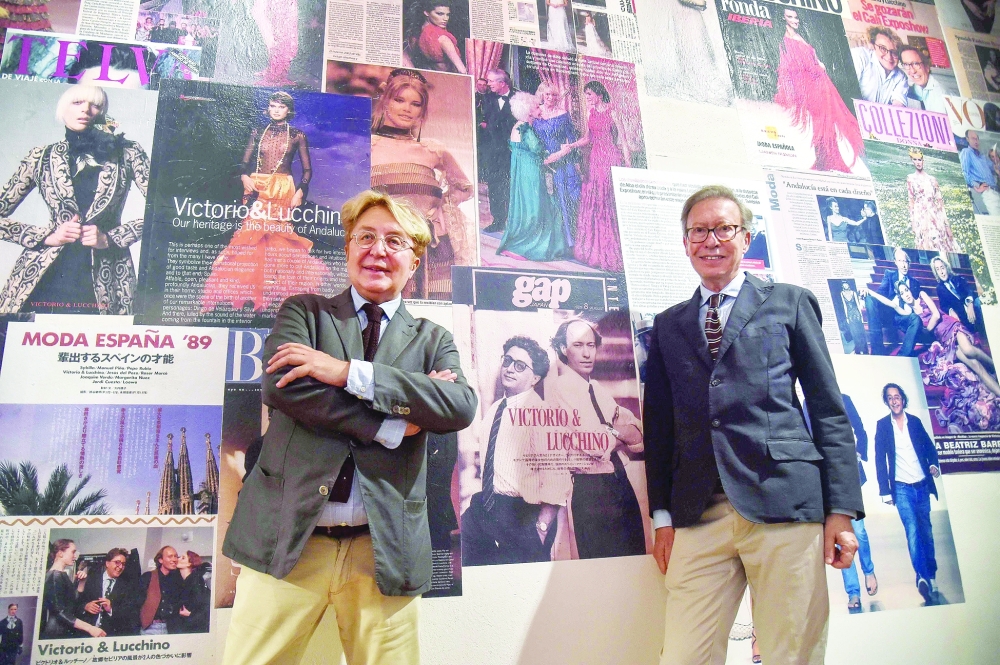 Spanish designers Jose Victor Rodriguez (L) and Jose Luis Medina, also known as "Victorio" and "Lucchino" pose for pictures during the inauguration of their museum at the Covento de Santa Clara in Palma del Rio, near Cordoba ,on June 23, 2022. Spanish designers Victorio and Lucchino met due to a common interest in fashion. They then fell in love, succeeded, went bankrupt, recovered and they now look back over more than 40 years of career, thanks to a museum that brings together dresses, fabrics, collection prototypes, accessories, footwear and jewelry. (Photo by CRISTINA QUICLER / AFP)

