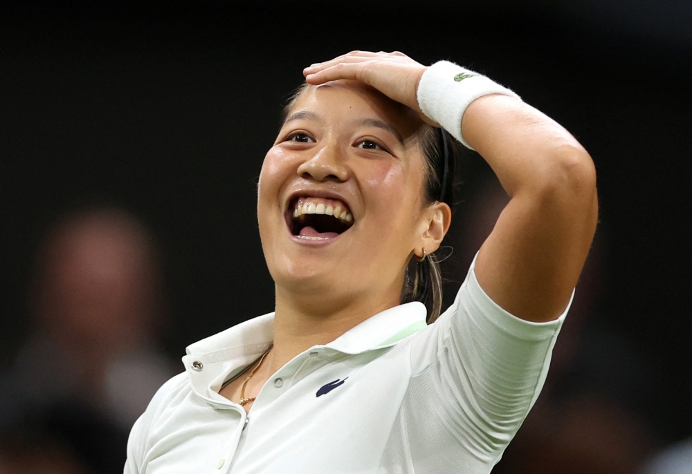 France's Harmony Tan celebrates winning her first round match against Serena Williams of the US. -- Reuters