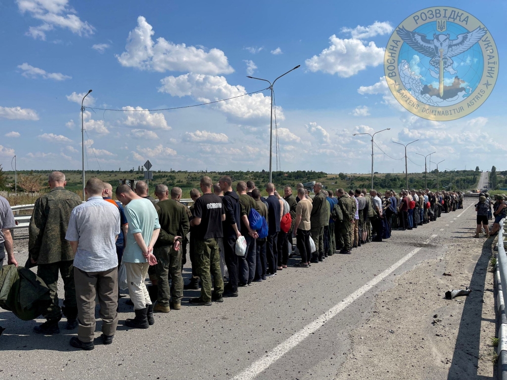 Prisoners line up alongside a road during a prisoner exchange, as Russia's attack on Ukraine continues, at a location given as Zaporizhzhia region, Ukraine, in this handout photo released on Wednesday. - Reuters