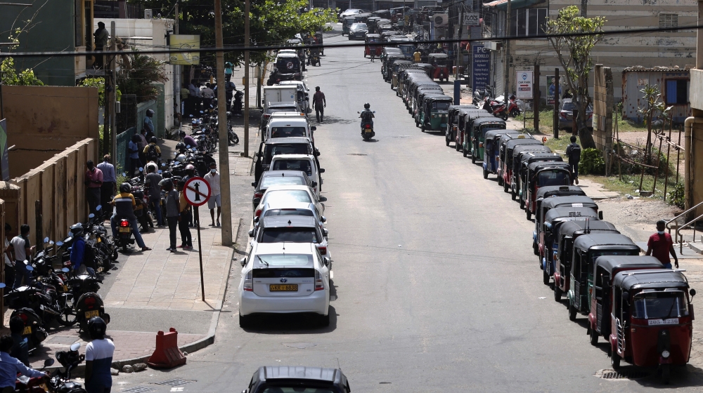 Motorbikes, cars and three-wheelers wait in a queue to buy petrol due to fuel shortage, during the country's economic crisis, in Colombo. - Reuters