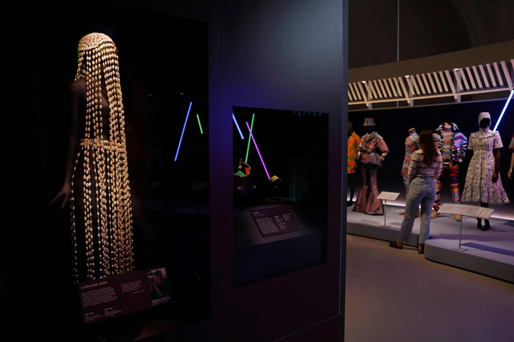 A Cowrie dress by Lafalaise Dion is seen during a photo call for the 'Africa Fashion' exhibition at the Victoria and Albert museum in London on June, 27, 2022.  Over 250 objects are on display for the exhibition, with approximately half of these drawn from the museum痴 collection, including 70 new acquisitions. Many of the garments on show are from the personal archives of a selection of iconic mid-twentieth century African designers. (Photo by CARLOS JASSO / AFP)

