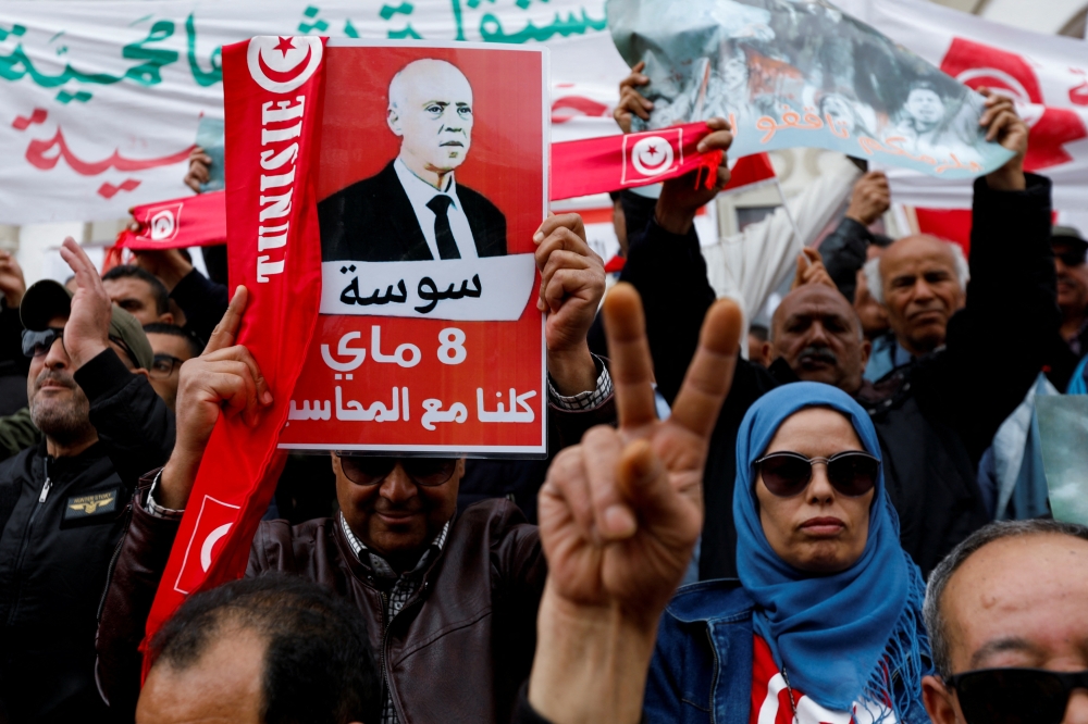 People carry banners and flags during a rally in support of Tunisian President Kais Saied in Tunis on May 8, 2022. - Reuters file photo