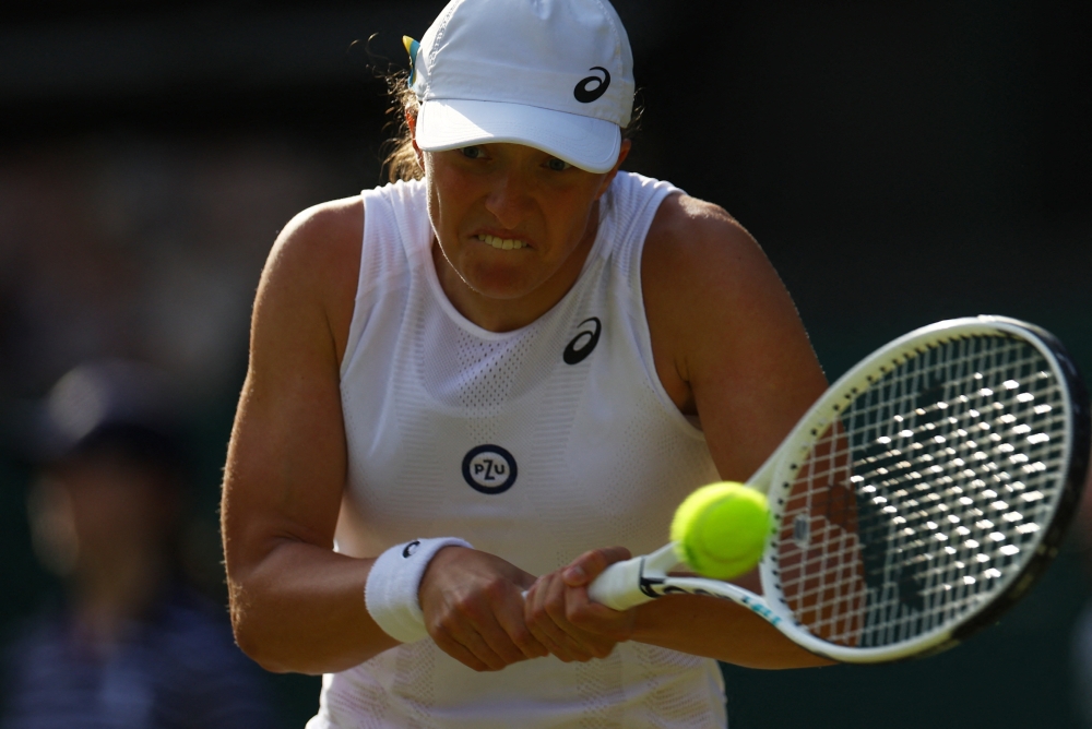 Tennis - Wimbledon - All England Lawn Tennis and Croquet Club, London, Britain - June 30, 2022 Poland's Iga Swiatek in action during her second round match against Netherlands' Lesley Pattinama Kerkhove REUTERS/Hannah Mckay