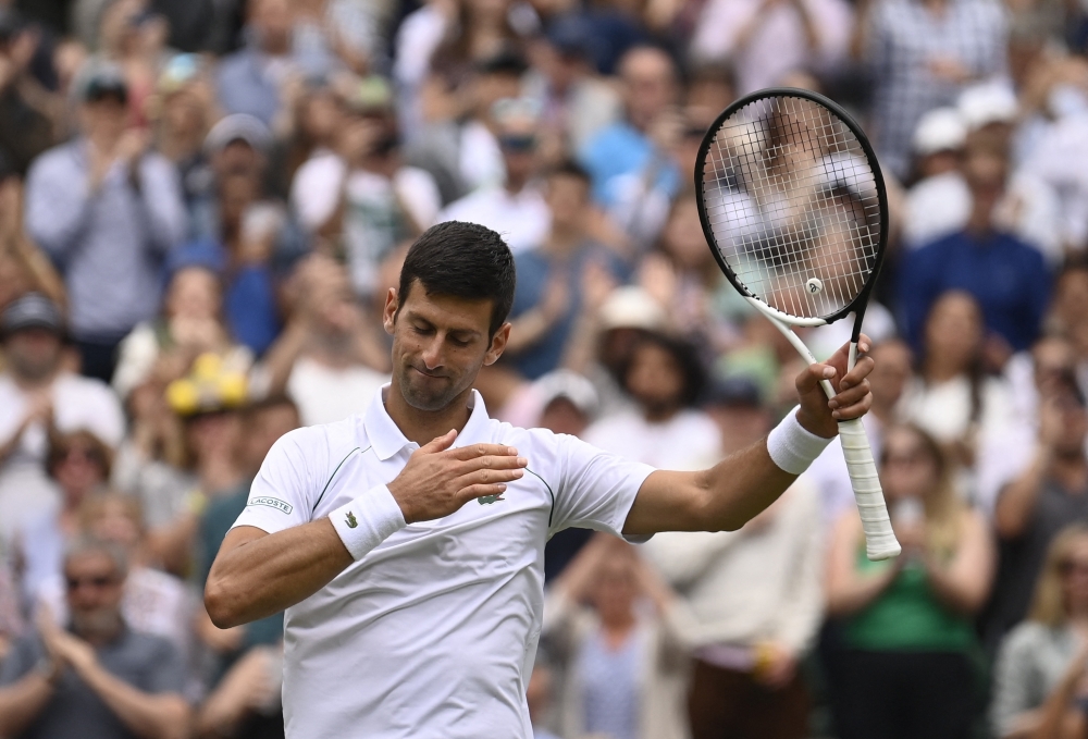 Novak Djokovic acknowledges the crowd after winning his third round match against Serbia's Miomir Kecmanovic.  — Reuters