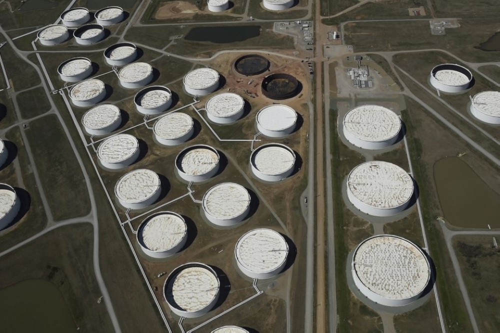 Crude oil storage tanks are seen from above at the Cushing oil hub, in Cushing, Oklahoma. — Reuters
