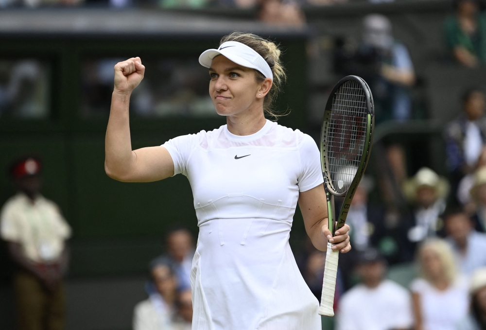 Romania's Simona Halep celebrates winning her quarterfinal against Amanda Anisimova of the US. --  Reuters