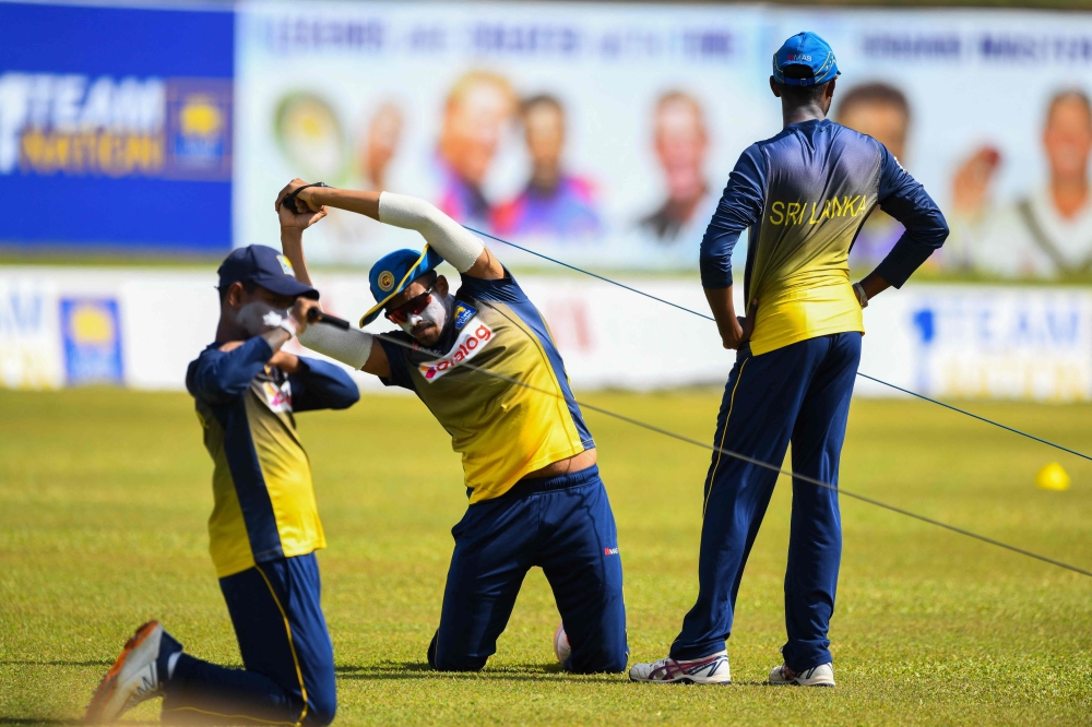 Sri Lanka's Maheesh Theekshana (C) attends a practice session at the Galle International Cricket Stadium in Galle. -- AFP