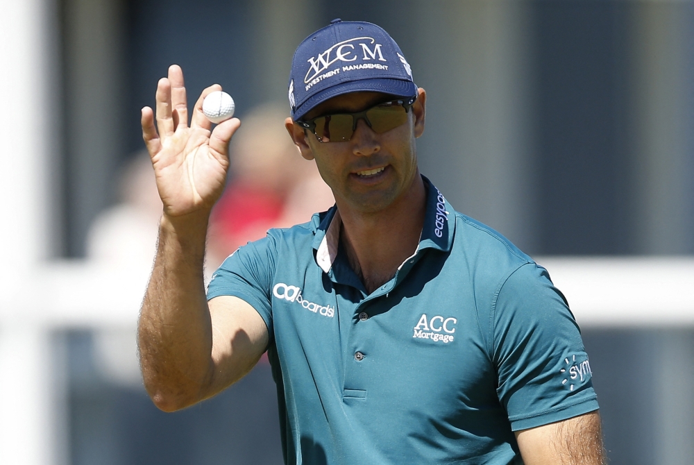 Cameron Tringale of the US waves to spectators after the first round. -- Reuters