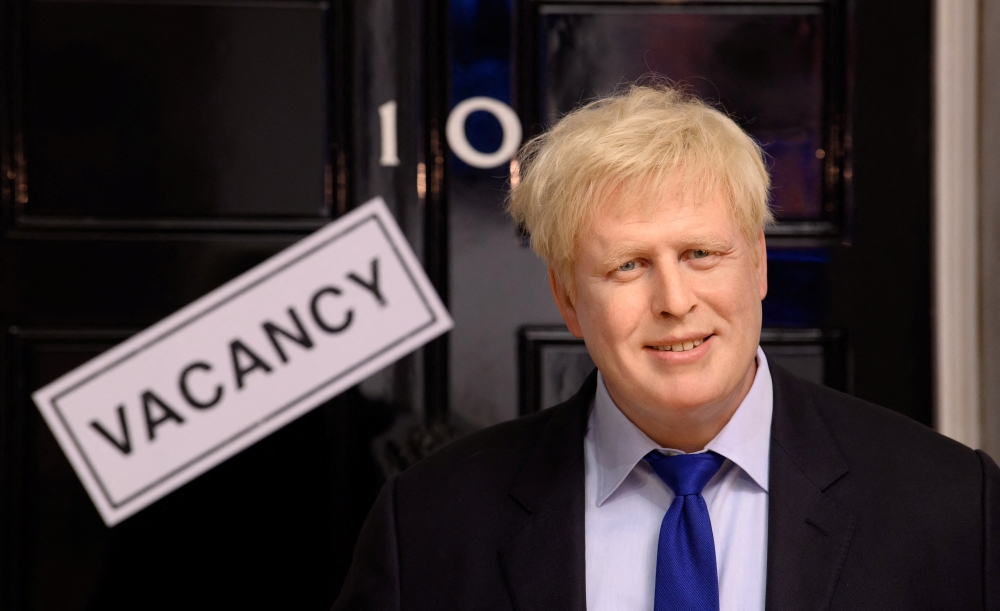 A wax figure of Boris Johnson is pictured next to a 'vacancy' sign on 10 Downing Street at Madame Tussauds, in London, on Thursday. - Reuters 
