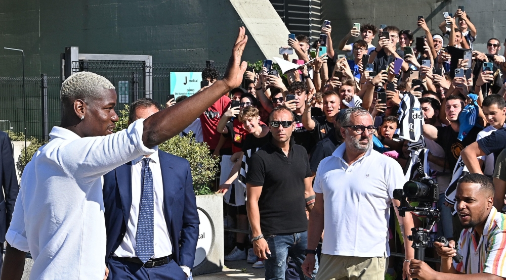 This picture taken on July 9, 2022 and released on July 11, 2022 by Italian news agence Ansa shows Paul Pogba arriving at Juventus football club's Medical Center, in Turin. -- AFP