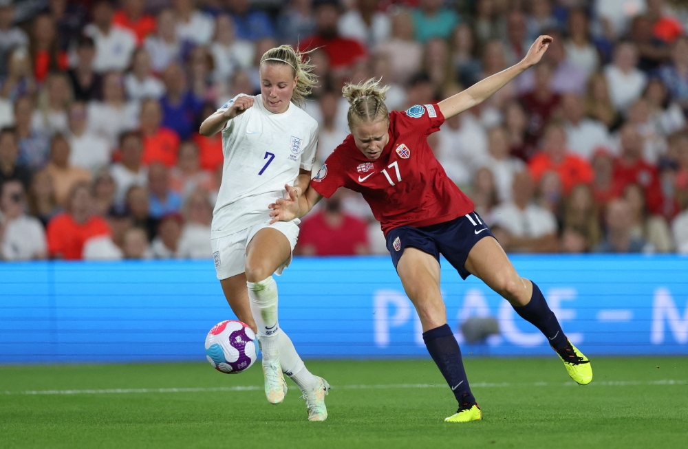 England's Beth Mead in action with Norway's Julie Blakstad. -- Reuters