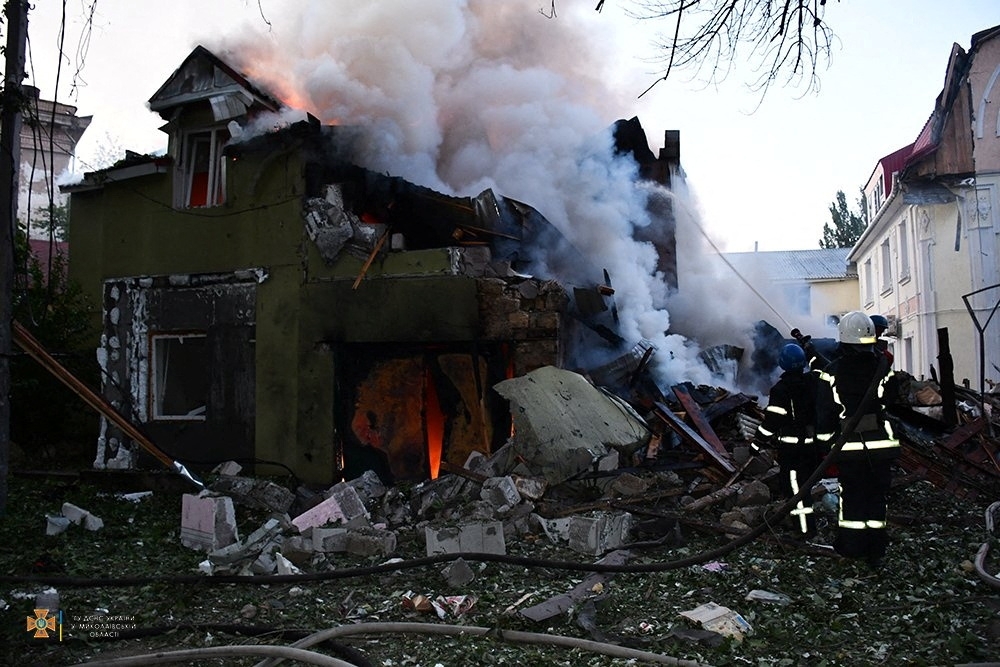 Firefighters work at a site of a residential building damaged by a Russian military strike, as Russia's attack on Ukraine continues in Mykolaiv. - Reuters