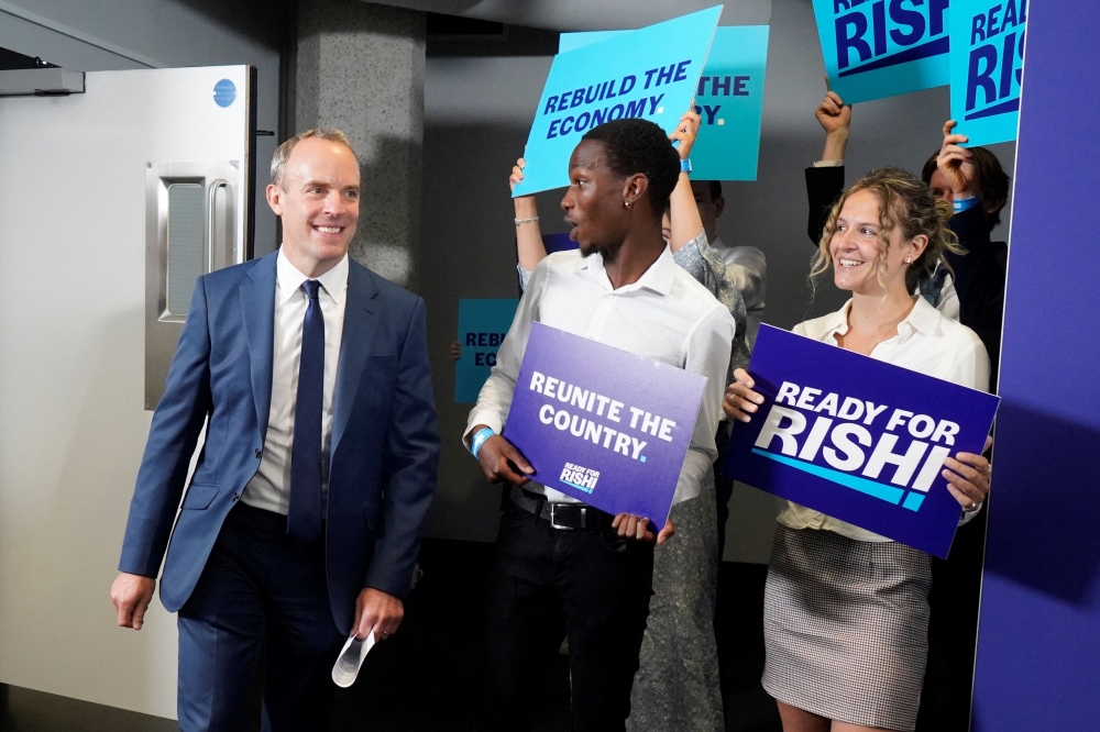 Britain's Justice Secretary and deputy Prime Minister Dominic Raab (L) leaves after speaking to endorse Rishi Sunak, during his campaign launch for his attempt to become the next Prime Minister in London. -AFP