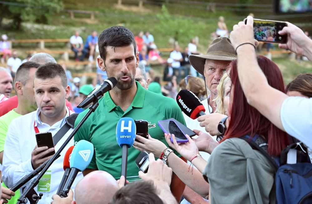 Novak Djokovic speaks to press after an exhibition match, organised to mark the opening of a tennis court at the "Archaeological park of the Bosnian pyramid" near Visoko, north of Sarajevo. -- AFP