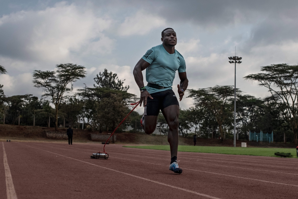 Kenya's sprinter Ferdinand Omanyala runs during a training session at the Kasarani stadium in Nairobi. -- AFP