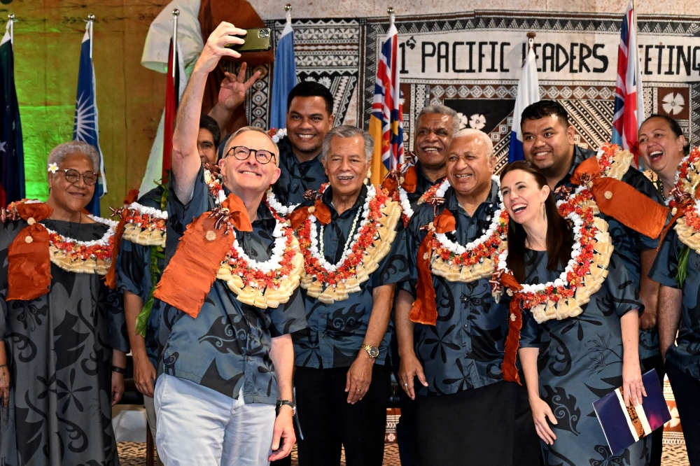 Australia's Prime Minister Anthony Albanese (front) takes a selfie with fellow leaders during the Pacific Islands Forum in Suva on Thursday. -- AFP
