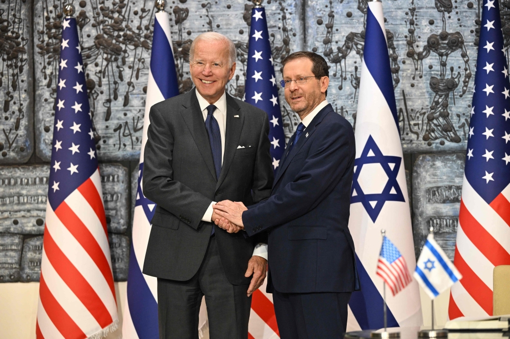 US President Joe Biden poses for a picture with Israeli President Isaac Herzog at the Presidential residence on Thursday. -- AFP