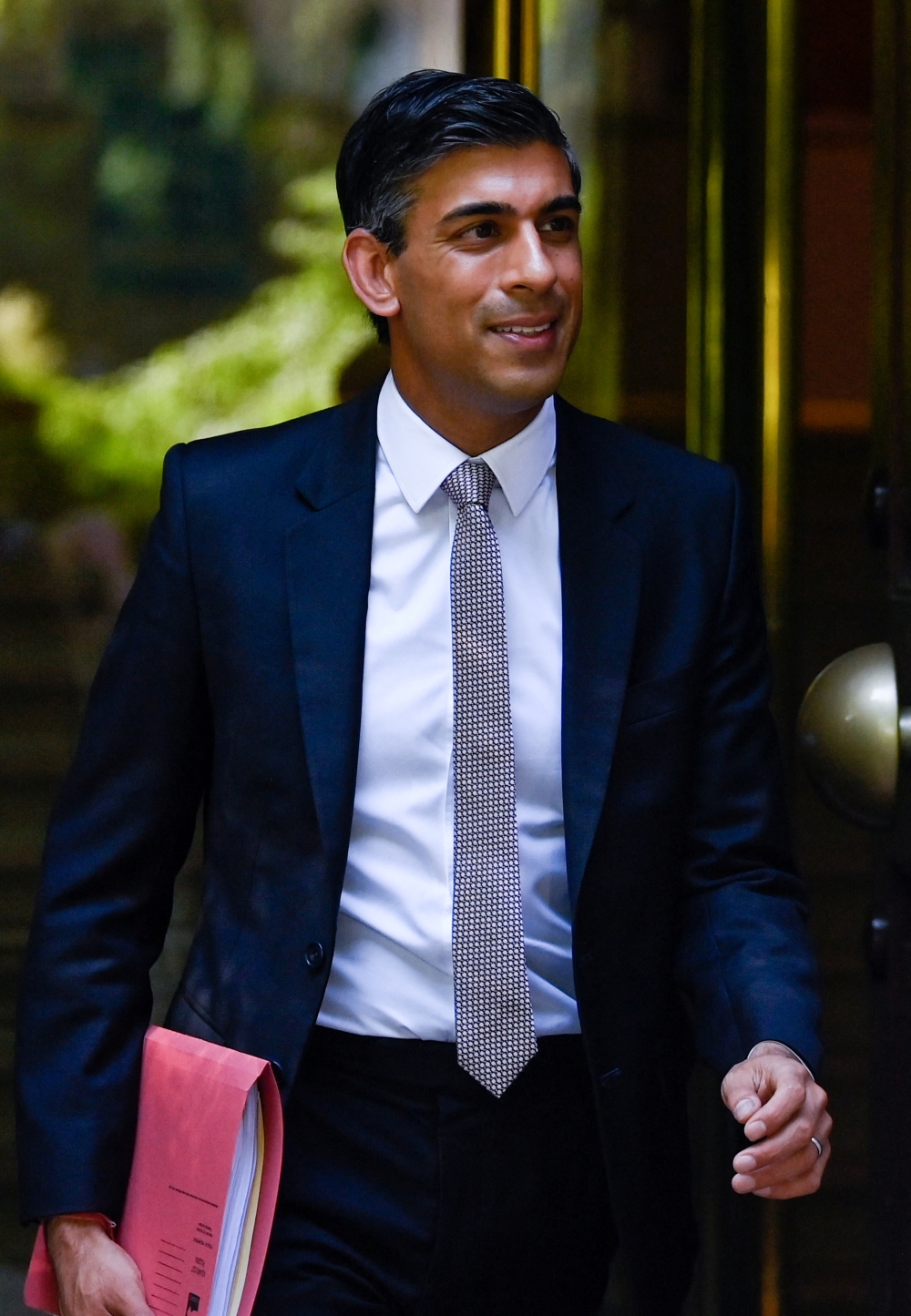Former Chancellor of the Exchequer Rishi Sunak walks in London on Thursday. -- Reuters