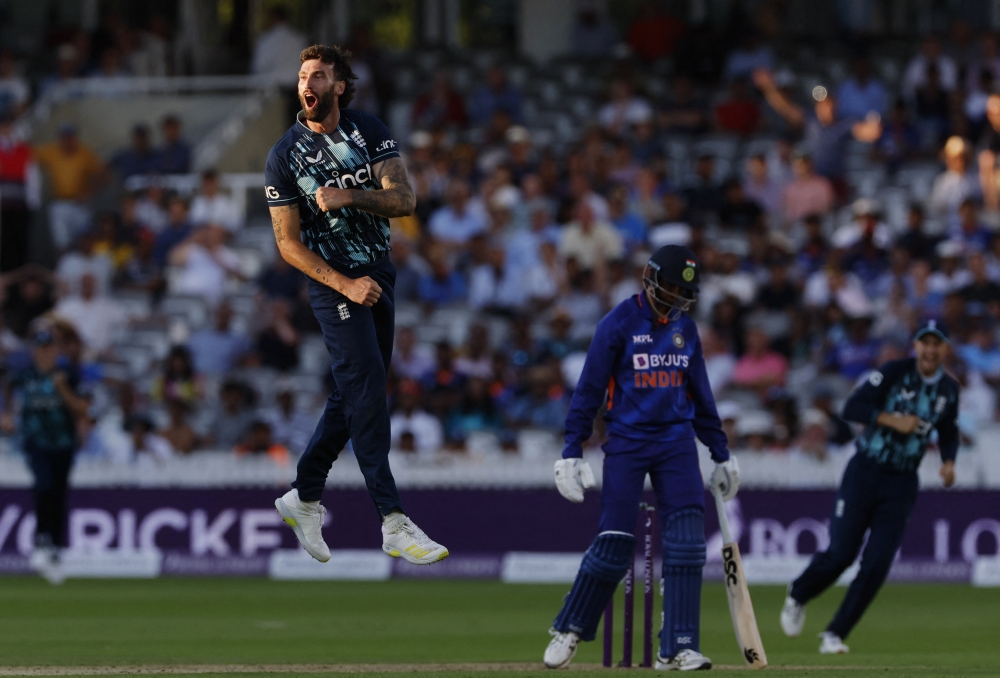 Cricket - One Day International Series - England v India - Lord's Cricket Ground, London, Britain - July 14, 2022 England's Reece Topley celebrates after the match and after taking the wicket of India's Prasidh Krishna for a total of 6 wickets Action Images via Reuters/Andrew Couldridge
