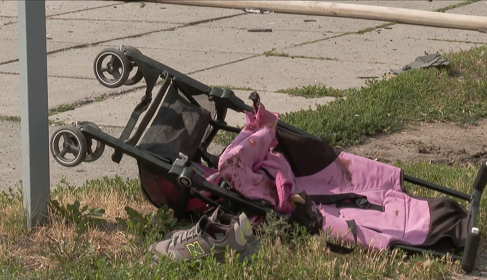A video grab taken from AFPTV footage shows a stroller lying on the ground after Russian missiles have struck Vinnytsia, in central Ukraine, killing at least 23 people including three children. - AFP