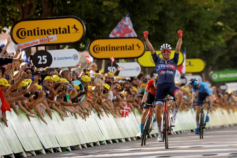 Cycling - Tour de France - Stage 13 - Le Bourg d'Oisans to Saint-Etienne - France - July 15, 2022 Trek - Segafredo's Mads Pedersen celebrates as he crosses the finish line to win stage 13 REUTERS/Christian Hartmann     TPX IMAGES OF THE DAY