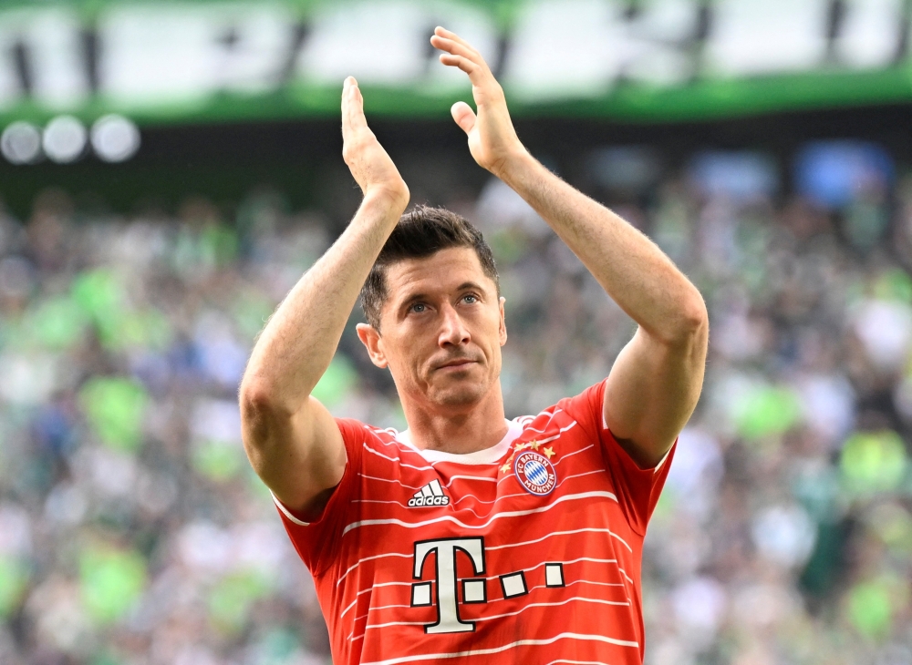 Bayern Munich's Robert Lewandowski celebrates after the match. -- Reuters