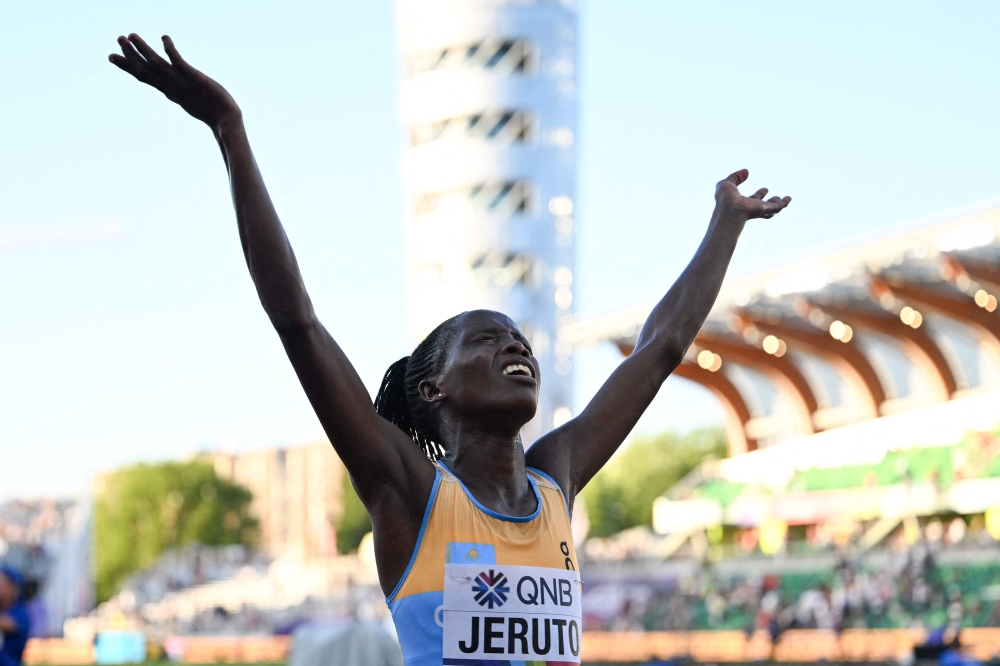TOPSHOT - Kazakhstan's Norah Jeruto crosses the finish line in the women's 3,000m steeplechase final during the World Athletics Championships at Hayward Field in Eugene, Oregon on July 20, 2022.  (Photo by Jewel SAMAD / AFP)