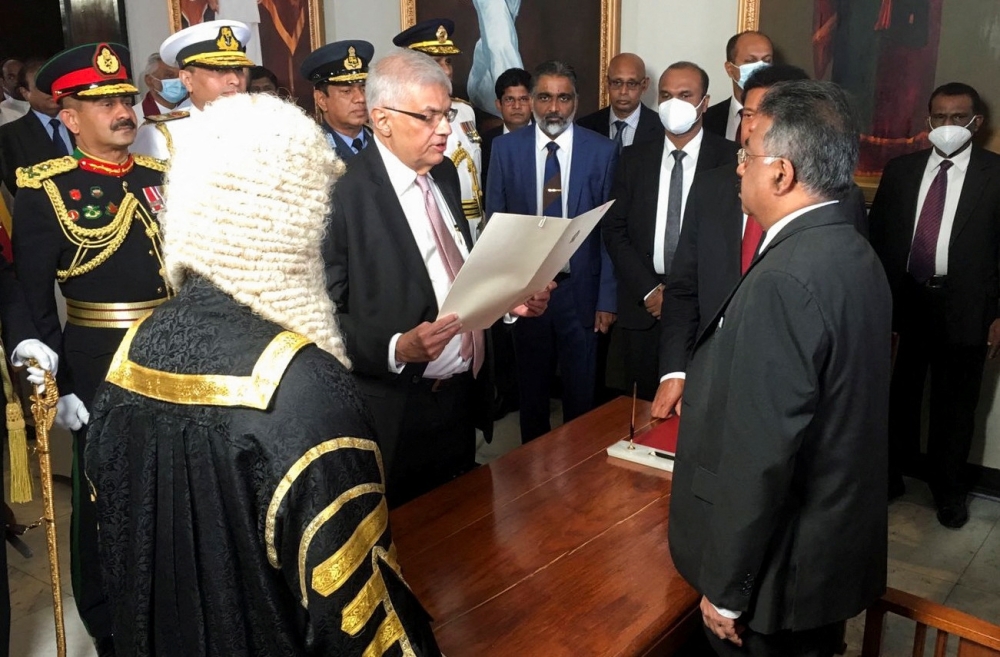 Ranil Wickremesinghe sworn in as the new president of Sri Lanka by the Chief Justice Jayantha Jayasuriya at the parliament in Colombo on Thursday. — Reuters