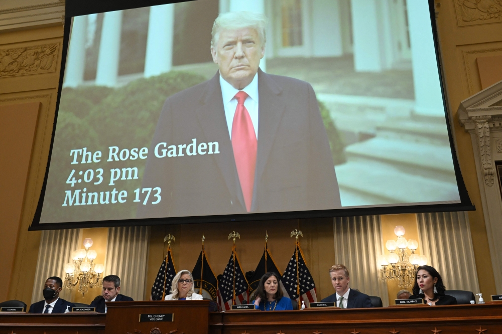 A January 6 video of Donald Trump telling his supporters to go home, is seen on screen during a hearing by the House Select Committee, on Thursday. - AFP 
