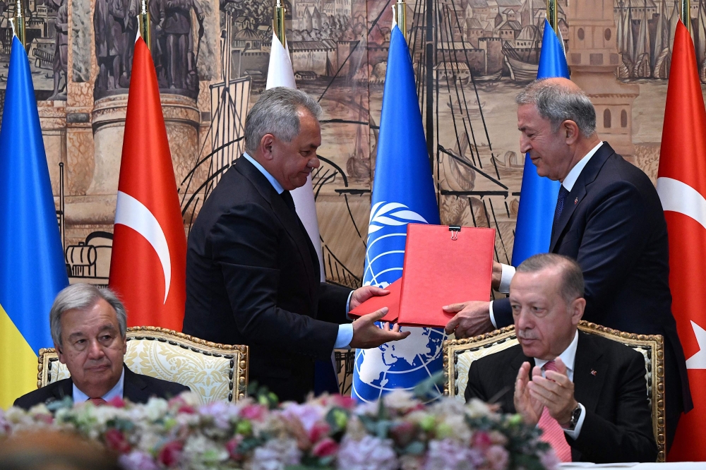 UN Secretary-General Antonio Guterres, Russian Defence Minister Sergei Shoigu, Turkish Defence Minister Hulusi Akar and Turkish President Recep Tayyip Erdogan attend the signature ceremony in Istanbul, on Friday. - AFP 