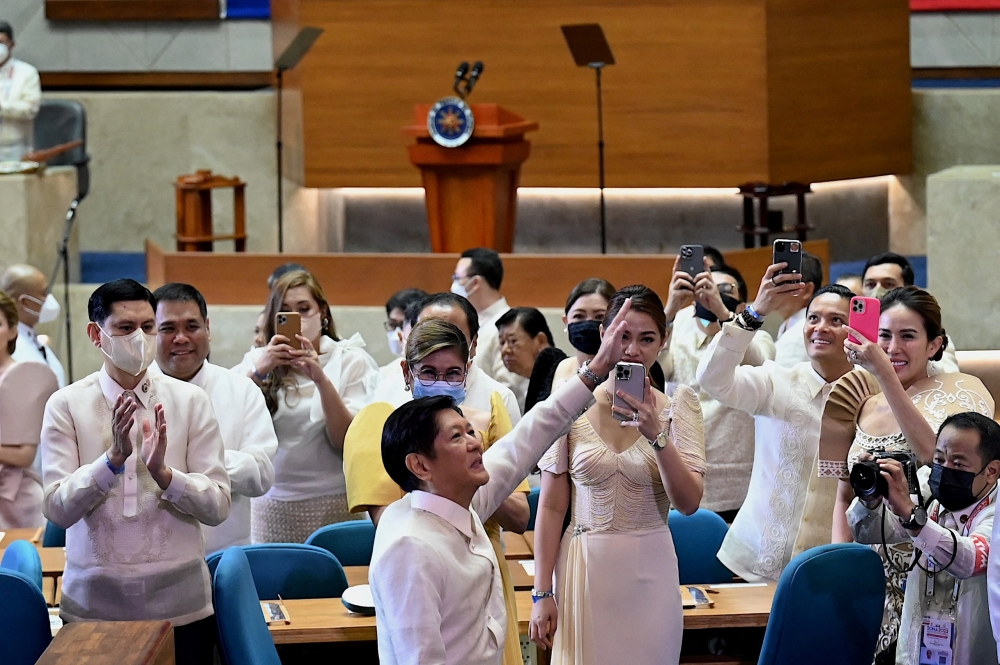 Philippine President Ferdinand Marcos Jr greets the audience during his first State of the Nation Address on Monday. -- Reuters
