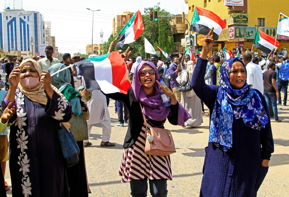 Sudanese women chant slogans during an anti-coup demonstration in the Bashdar station area in southern Khartoum, on Tuesday. - AFP