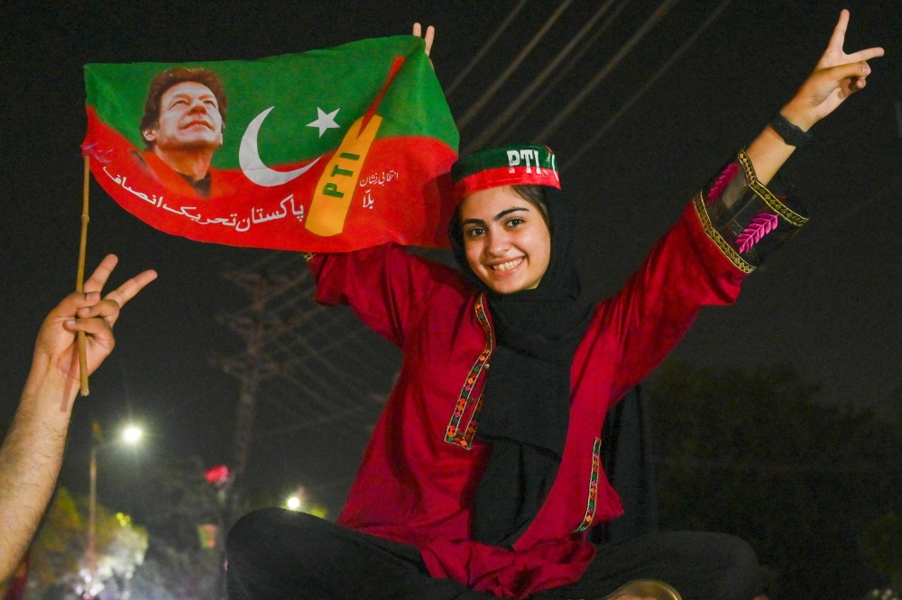 Supporters of former prime minister Imran Khan gather on Tuesday to celebrate after Supreme Court declared that Khan's candidate should be next Chief Minister of the Punjab province, nullifying provincial assembly deputy speaker's last week ruling in Lahore. - AFP