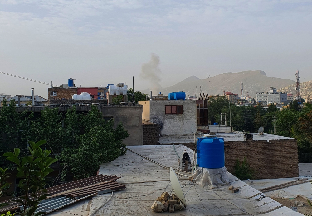 In this photograph taken on July 31, smoke rises from a house following a US drone strike in the Sherpur area of Kabul. - AFP