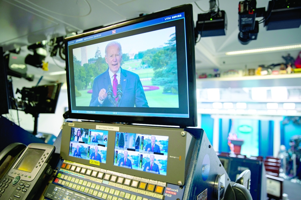 President Joe Biden is seen on a screen speaking from the White House during a nationally televised address where he announced that a US airstrike in Afghanistan killed the Al Qaeda leader Ayman al Zawahri in Washington.