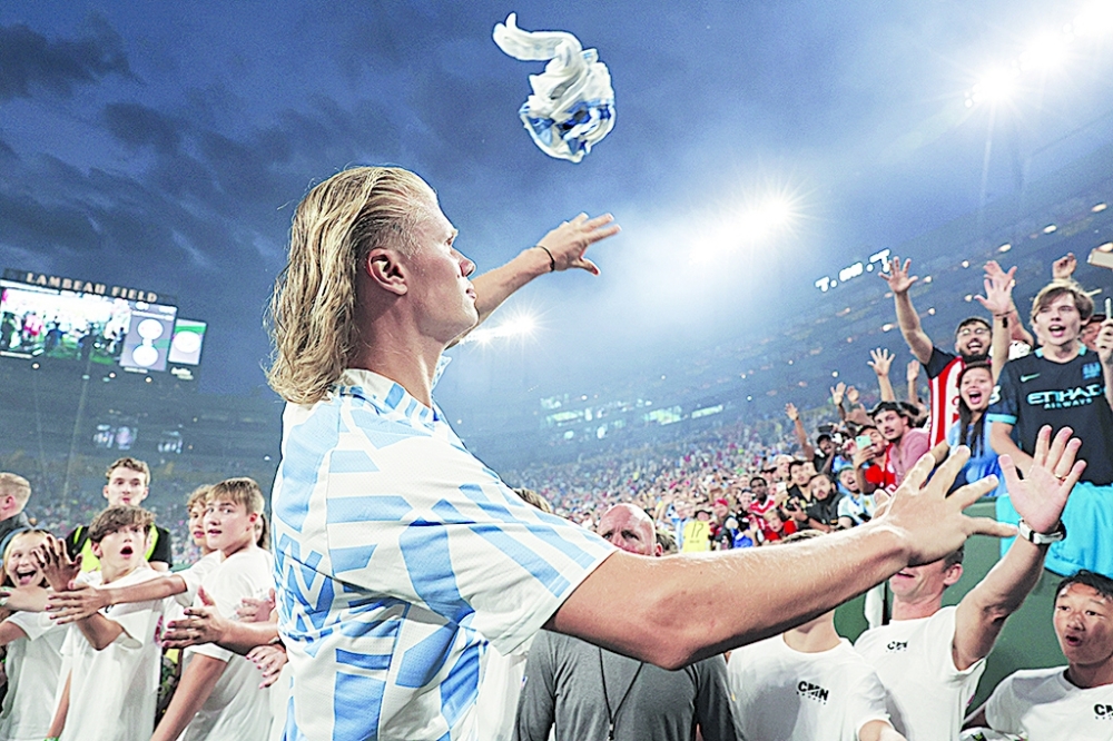 Erling Haaland of Manchester City throws his shirt into the crowd after the pre-season friendly match between Bayern Munich and Manchester City at Lambeau Field in Green Bay, Wisconsin. - AFP 
Bayern Munich v Manchester City - Pre-Season Friendly