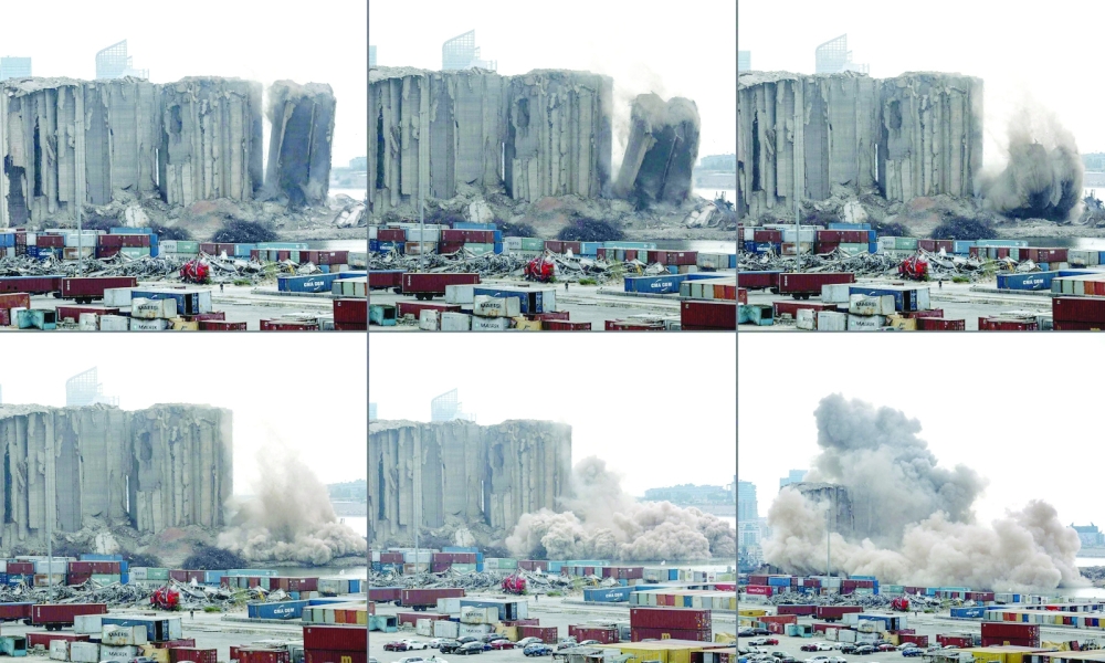 This combination of pictures shows part of the grain silos in the port of Beirut collapsing on Thursday. — AFP