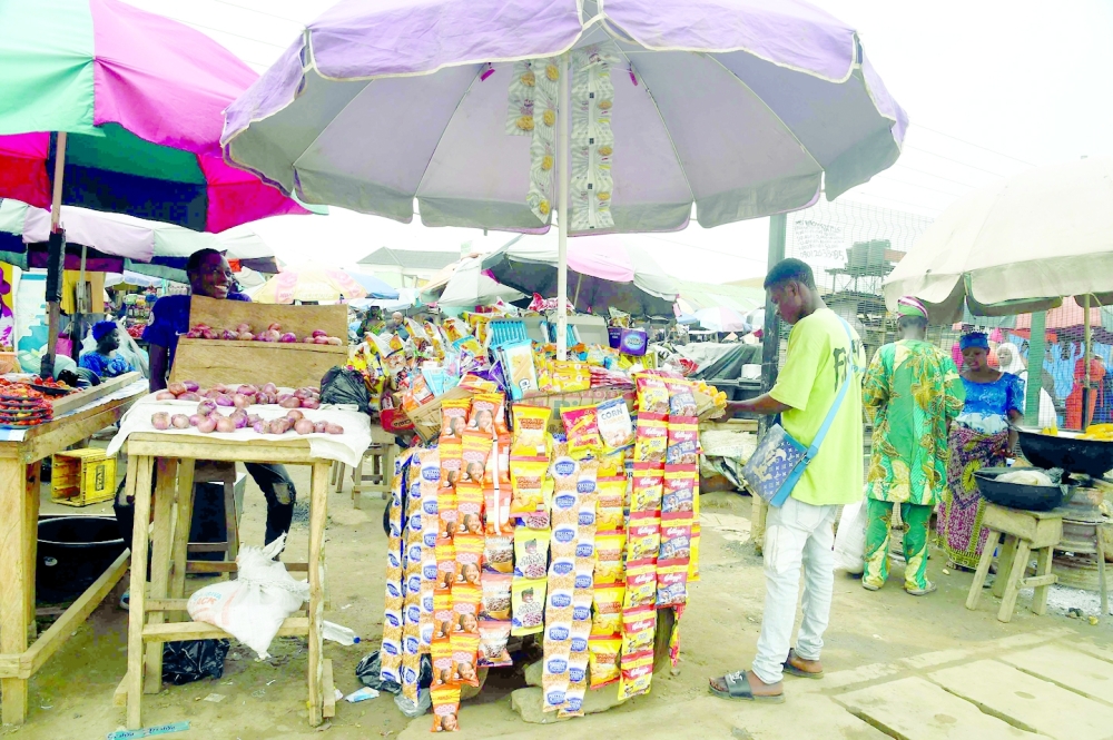 A vendor displays sachets of basic necessities at Ibafo market, Ogun State in southwest Nigeria. - AFP
