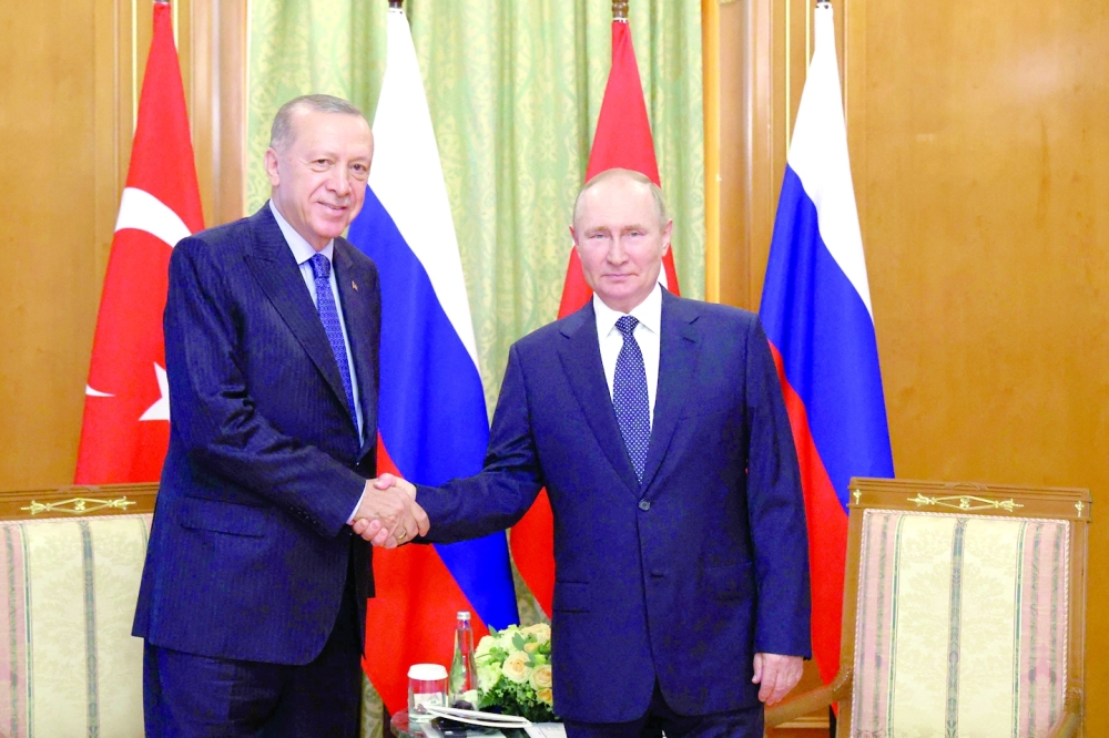 Russian President Vladimir Putin (R) with Turkish President Recep Tayyip Erdogan during a meeting in Sochi, on Friday. - AFP
