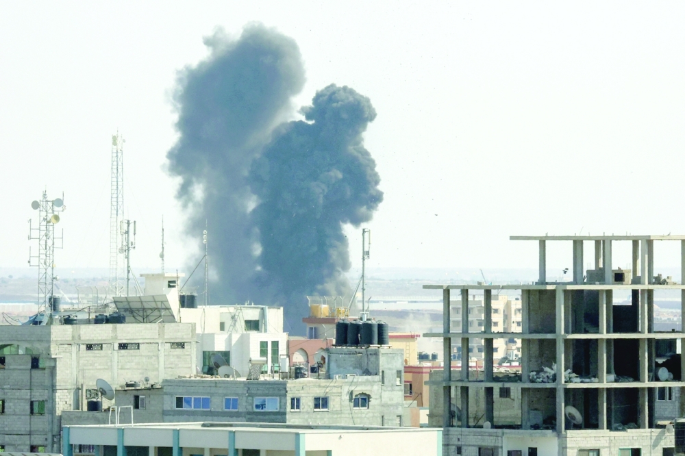 Israeli air strike flattened a residential building in Rafah. -- AFP